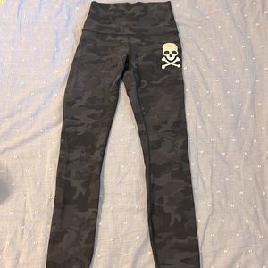 Lululemon girls black camo leggings with skull and cross-bone decal